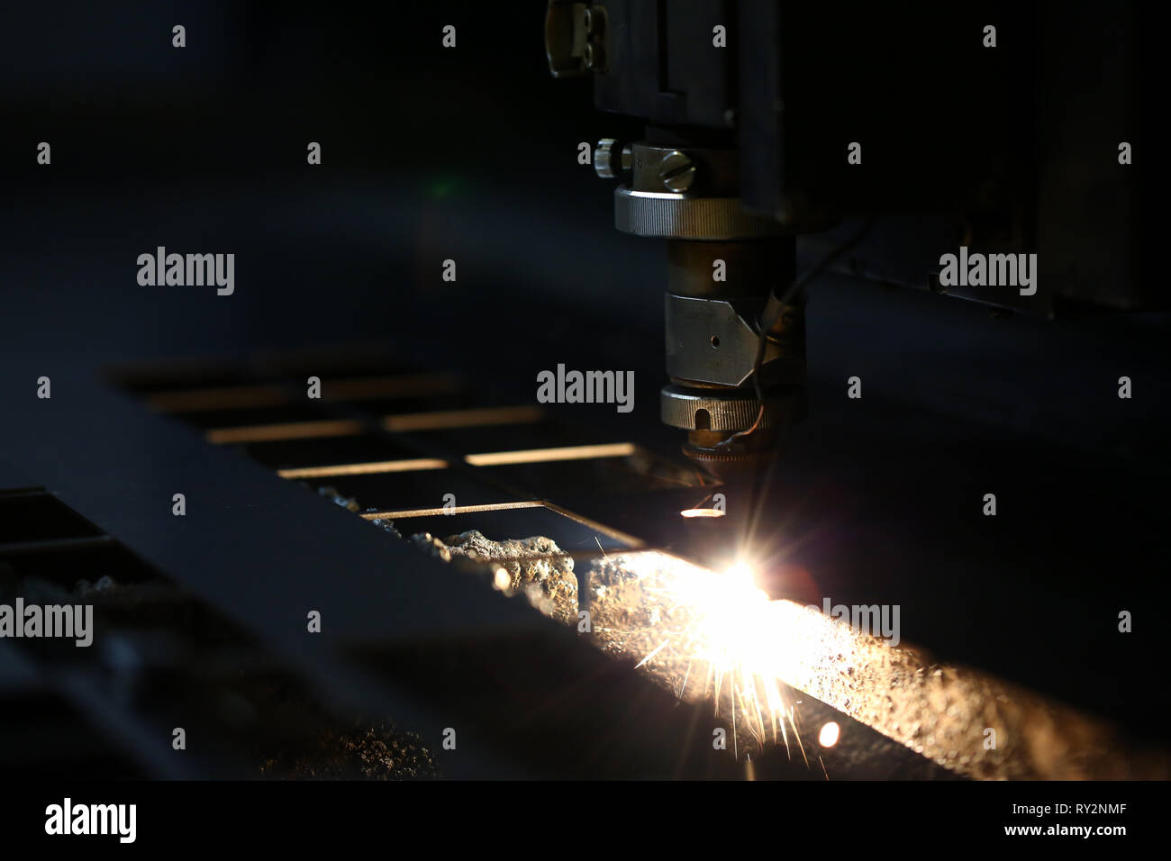 Sparks fly out machine head for metal processing Stock Photo