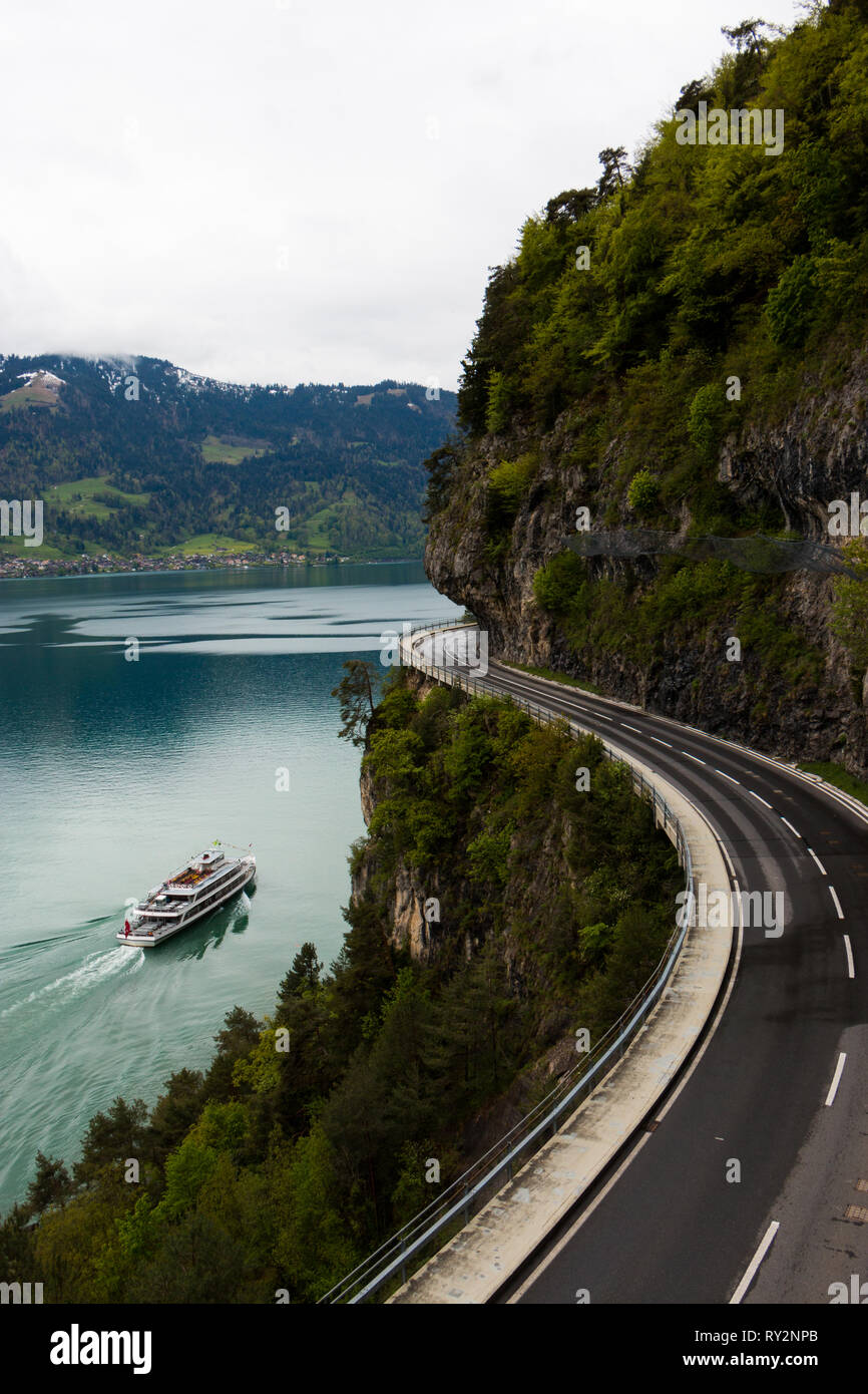 Boat and Road and car at swiss lake Thun, road empty Stock Photo Alamy