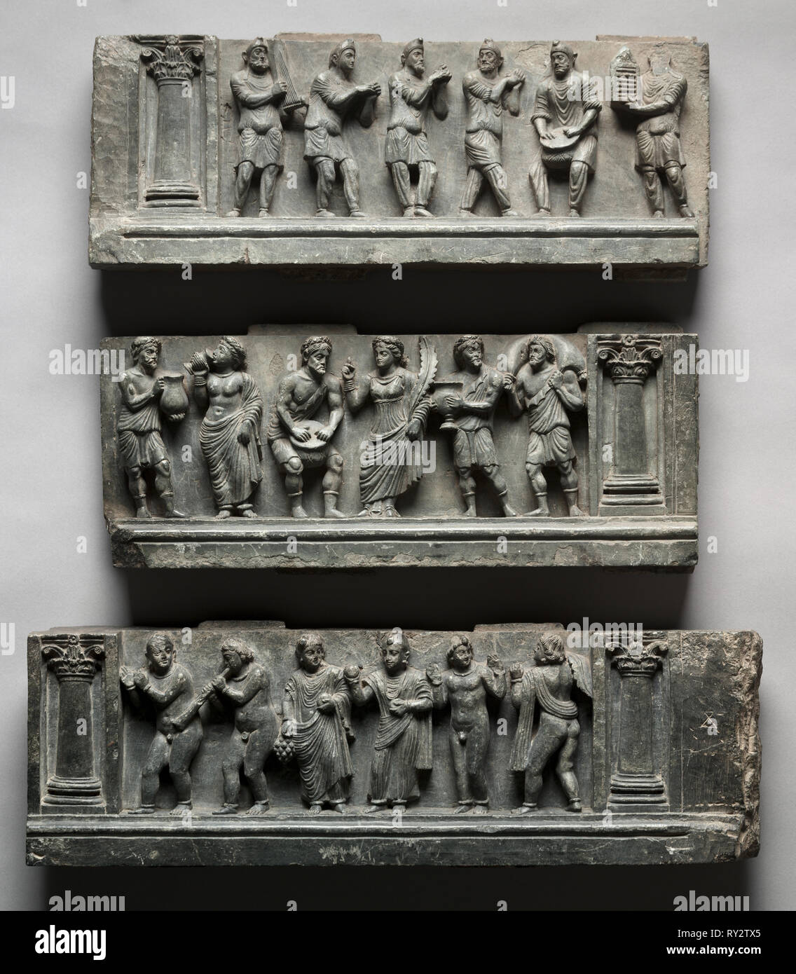 Bacchanalian Relief, 1-100. Pakistan, Gandhara, Buner area, early Kushan Period (AD 1-320). Schist; overall: 49.6 x 150.5 cm (19 1/2 x 59 1/4 in.); first section: 17.1 x 44.5 cm (6 3/4 x 17 1/2 in.); second section: 16.5 x 53 cm (6 1/2 x 20 7/8 in.); third section: 16 x 53 cm (6 5/16 x 20 7/8 in Stock Photo