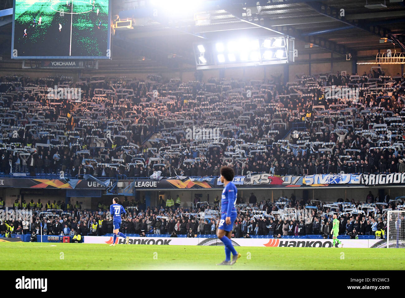 LONDON, ENGLAND - FEBRUARY 21, 2019: Malmo ultras pictured during the second leg of the 2018/19 UEFA Europa League Round of 32 game between Chelsea FC (England) and Malmo FF (Sweden) at Stamford Bridge. Stock Photo