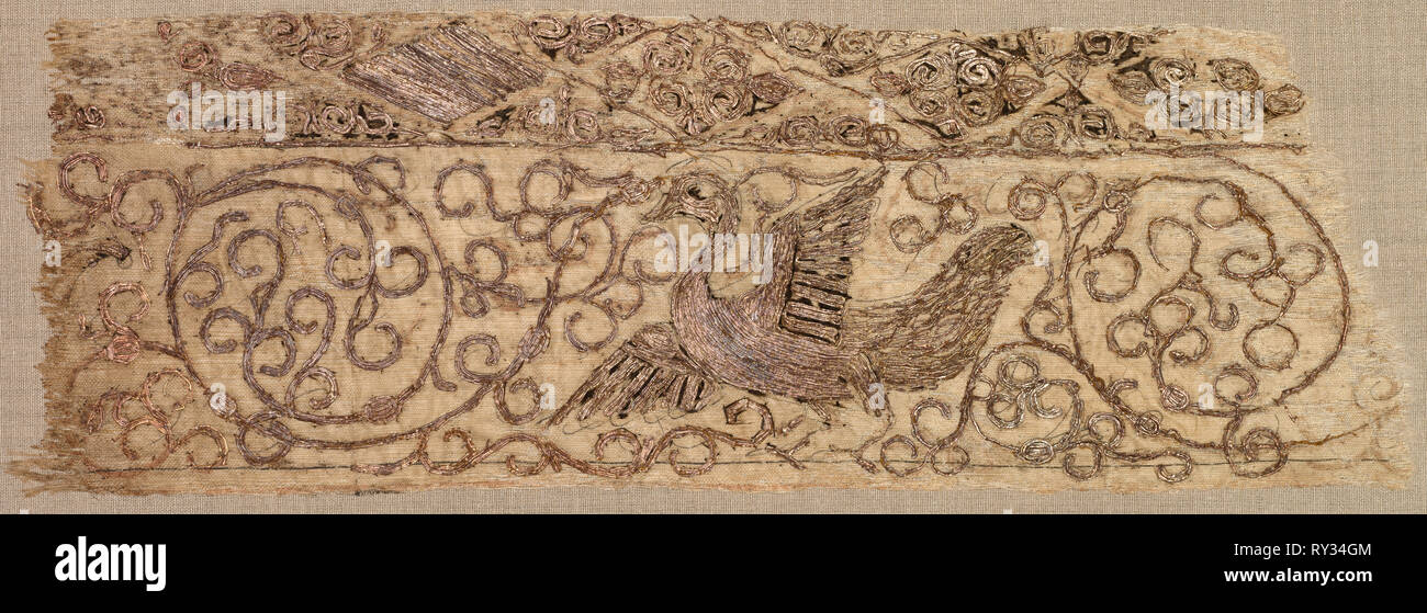 Embroidered fragment with bird among vines, 1100s. Iraq, Baghdad, Seljuq period. Plain weave: silk warp and cotton weft (mulham); embroidery, couched and split stitches: silk and metallic thread; overall: 7.3 x 21.6 cm (2 7/8 x 8 1/2 in Stock Photo