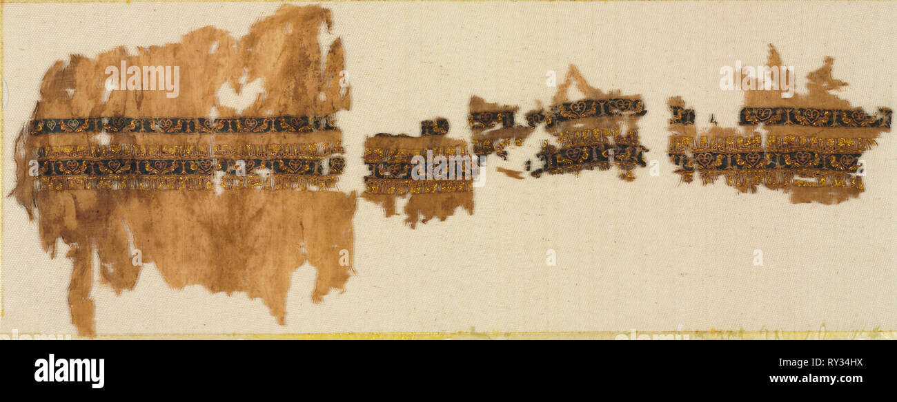 Tiraz with gold, probably from a wide sleeve, 1013-1020. Egypt, Fatimid period, reign of Caliph al-Hakim, 1013–20. Plain weave with inwoven tapestry weave: linen, silk, and gold filé; overall: 23.5 x 62.3 cm (9 1/4 x 24 1/2 in Stock Photo