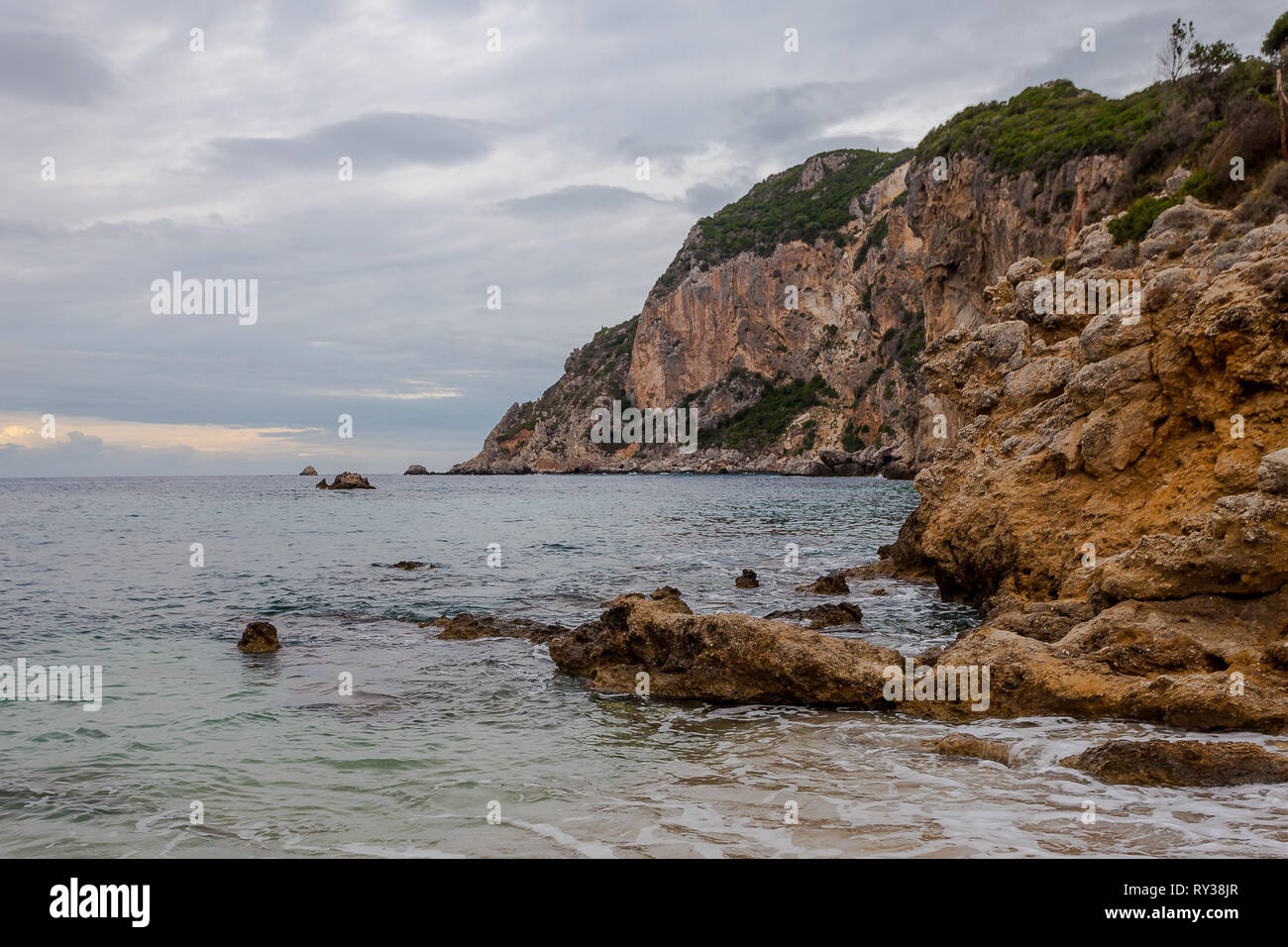 Paleokastritsa bay cliffs on a rainy day, Corfu Island, Greece Stock Photo