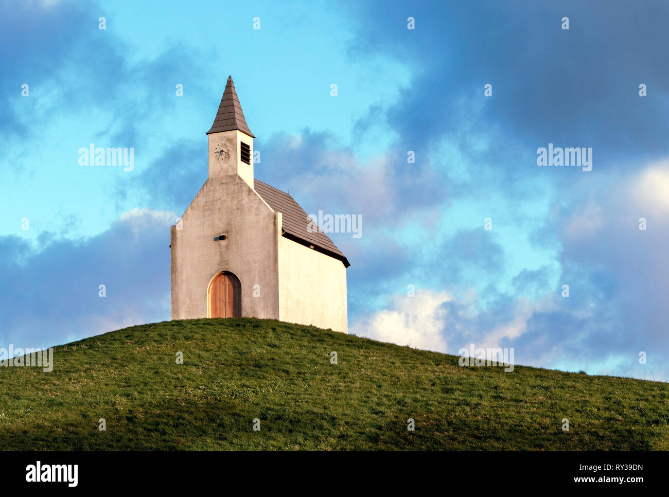 The little white chapel church on the hill. - Image Stock Photo