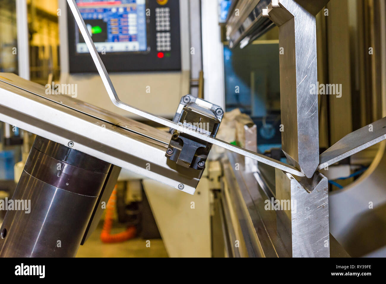 Hand robot working automatic cutting and bending metal sheet. operator