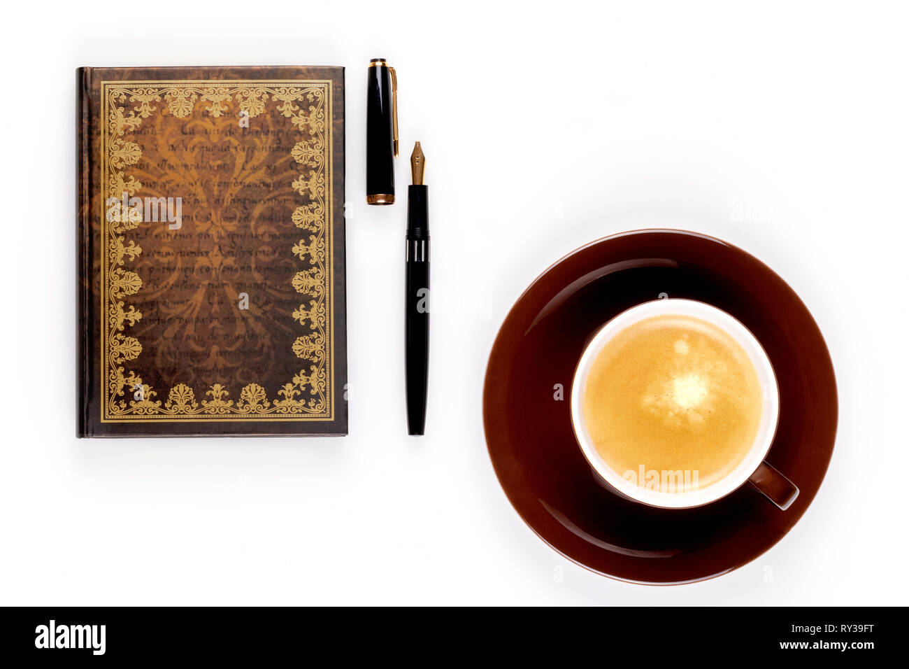 Closeup photo of notebook with old golden ink pen and cup of strong coffee on white background. - Image Stock Photo