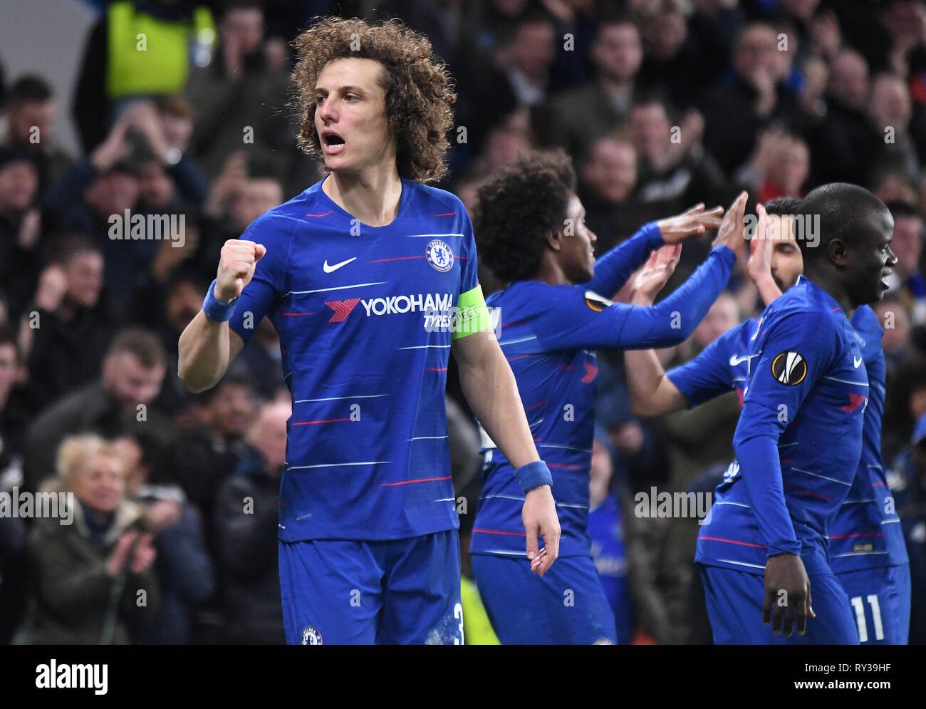 LONDON, ENGLAND - MARCH 7, 2019: David Luiz of Chelsea celebrates after Willian Borges da Silva of Chelsea scored a goal during the first leg of the 2018/19 UEFA Europa League Last 16 Round game between Chelsea FC (England) and Dynamo Kyiv (Ukraine) at Stamford Bridge. Stock Photo