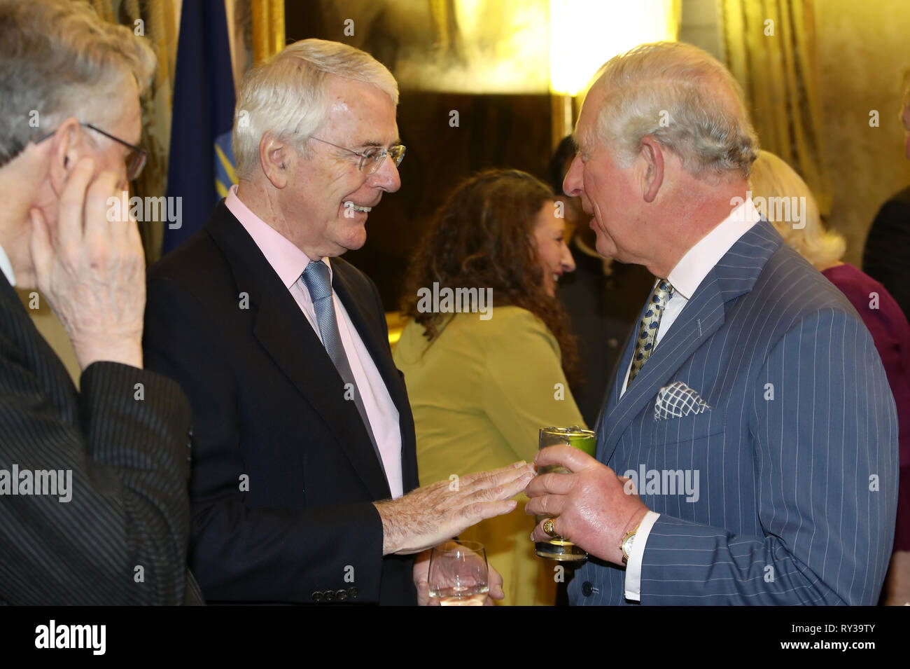 Prince of Wales (right) speaks with former Prime Minister John Major at the annual Commonwealth Day reception at Marlborough House, the home of the Commonwealth Secretariat in London. Stock Photo