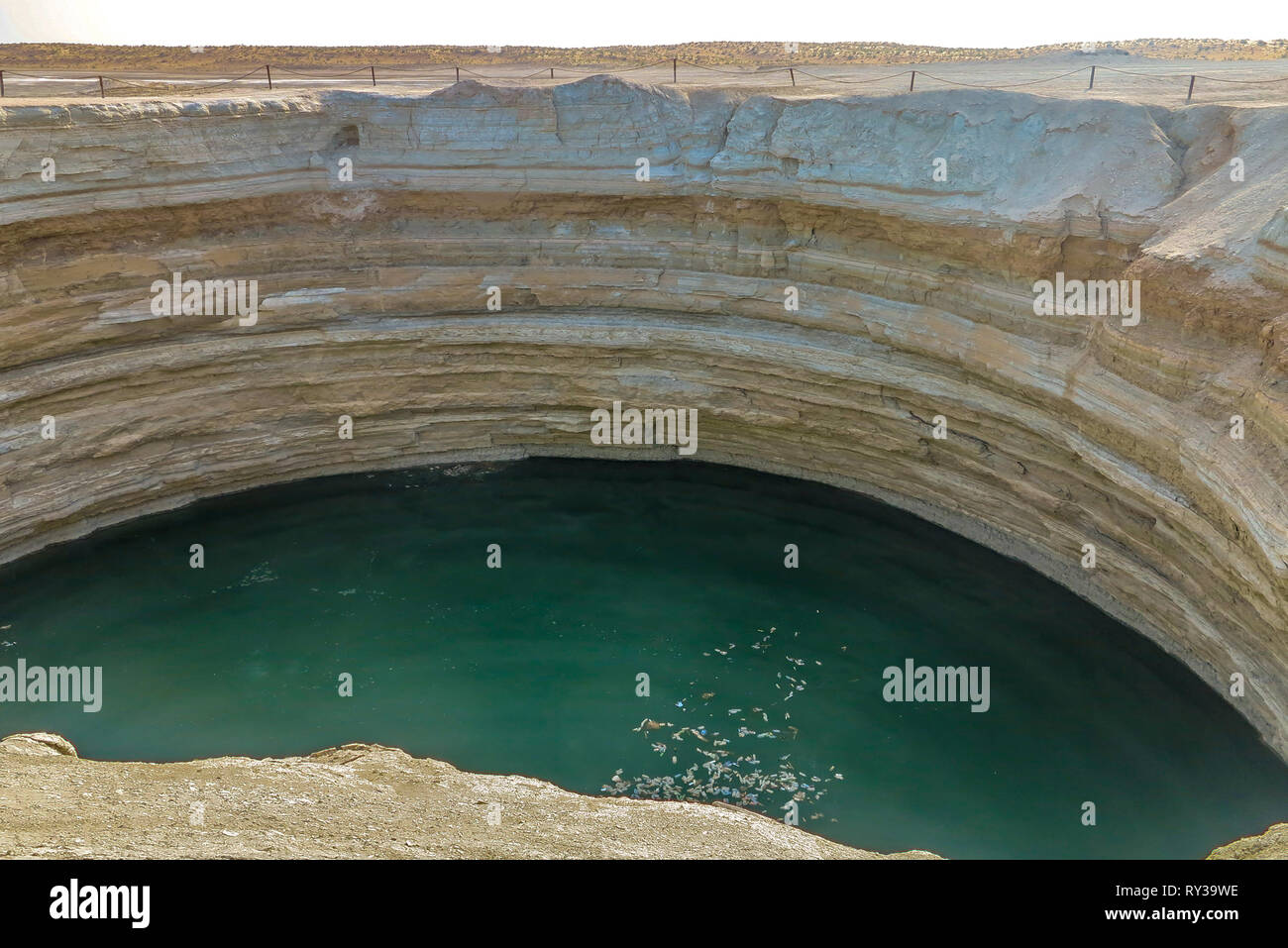 Darvaza Mud Volcano Crater Pit Filled with Water View Stock Photo