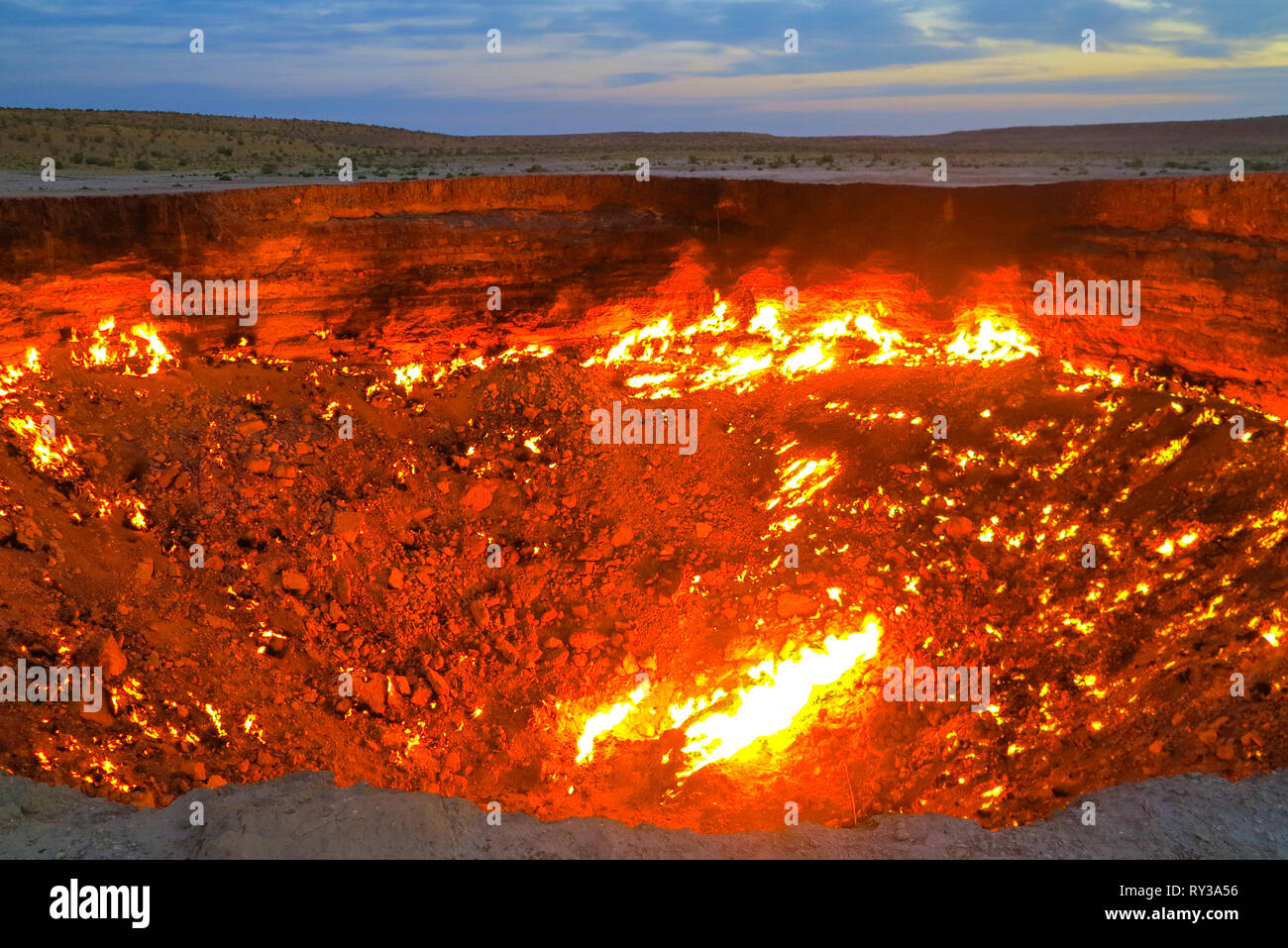 Darvaza Gas Crater Pit Breathtaking Flames Close Up at Sunrise Stock Photo