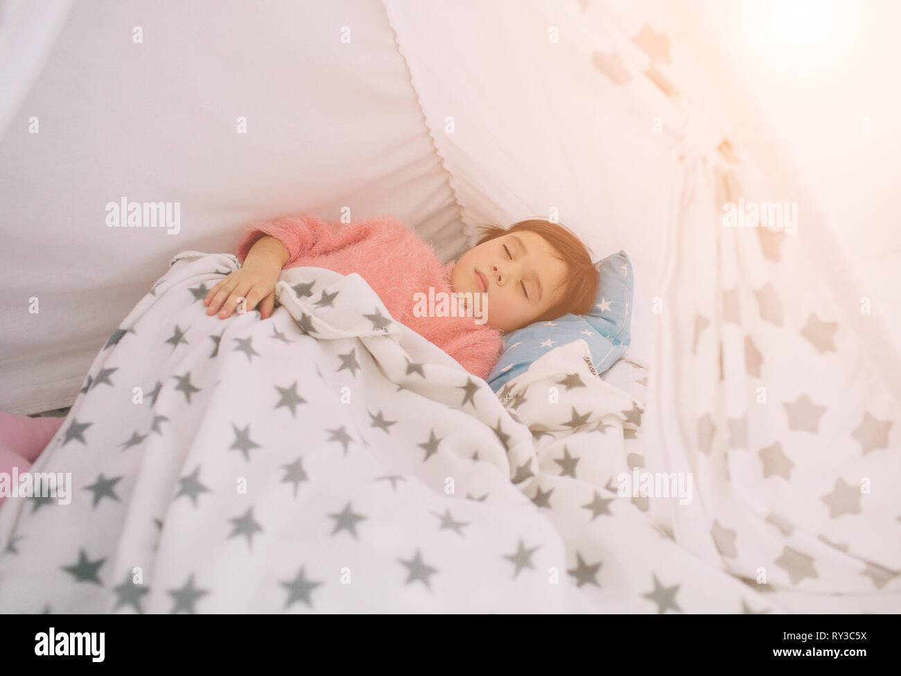 Sweet little girl is sleeping. The baby is sleeping at home Stock Photo