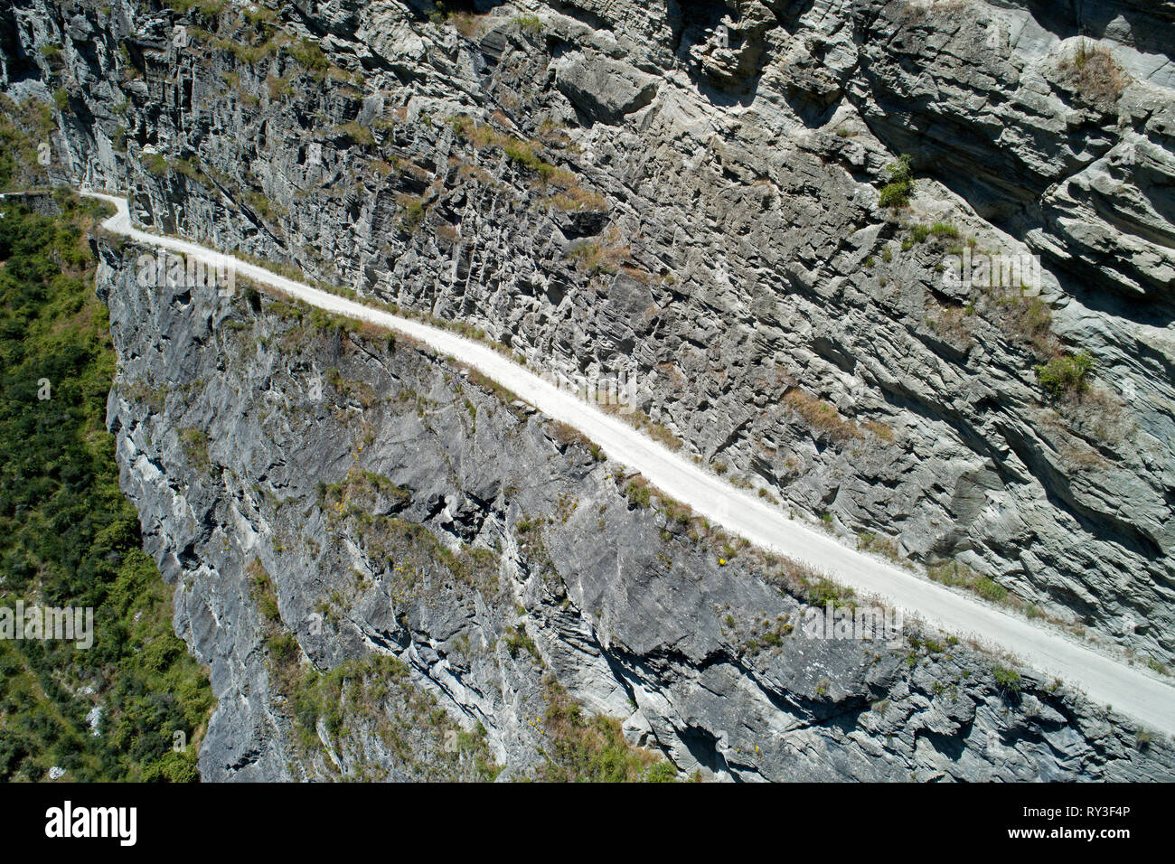 Road into Skippers Canyon at Pinchers Bluff, near Queenstown, South Island, New Zealand - aerial Stock Photo