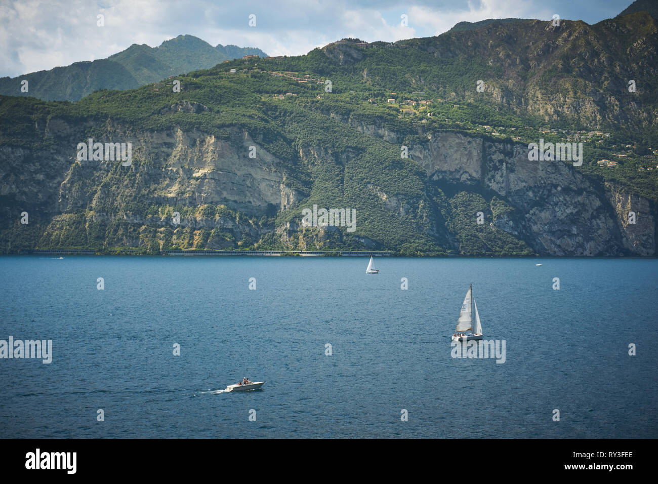 Malcesine, Italy - August, 2018. Sailboats on the lake Garda, the biggest Italian lake, near the town of Malcesine. Stock Photo