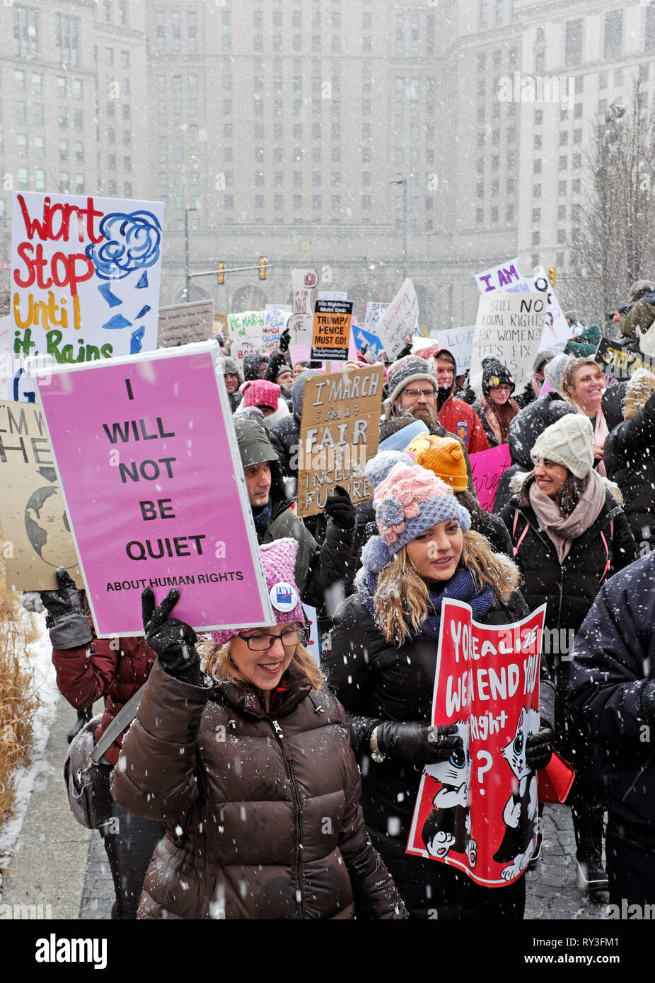 Participants in the 2019 Women's March in Cleveland, Ohio, USA demonstrate on Public Square during a snowstorm. Stock Photo
