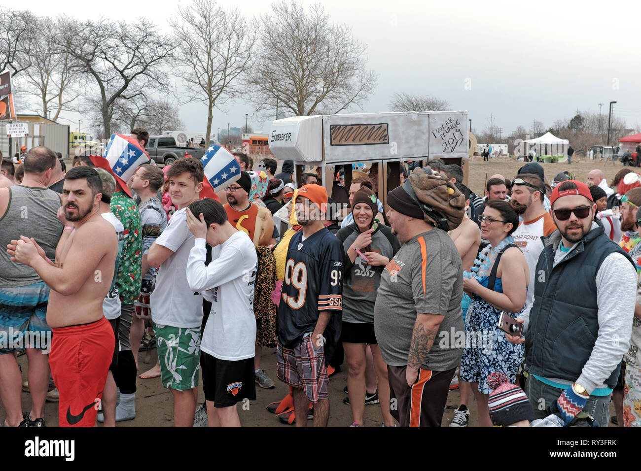Participants in the 2019 Polar Plunge wait in line to take a dip in the ice filled Lake Erie waters off Edgewater Park in Cleveland, Ohio, USA. Stock Photo