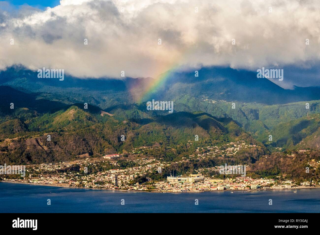 Dominica, aerial view of the capital Roseau, under a rainbow Stock