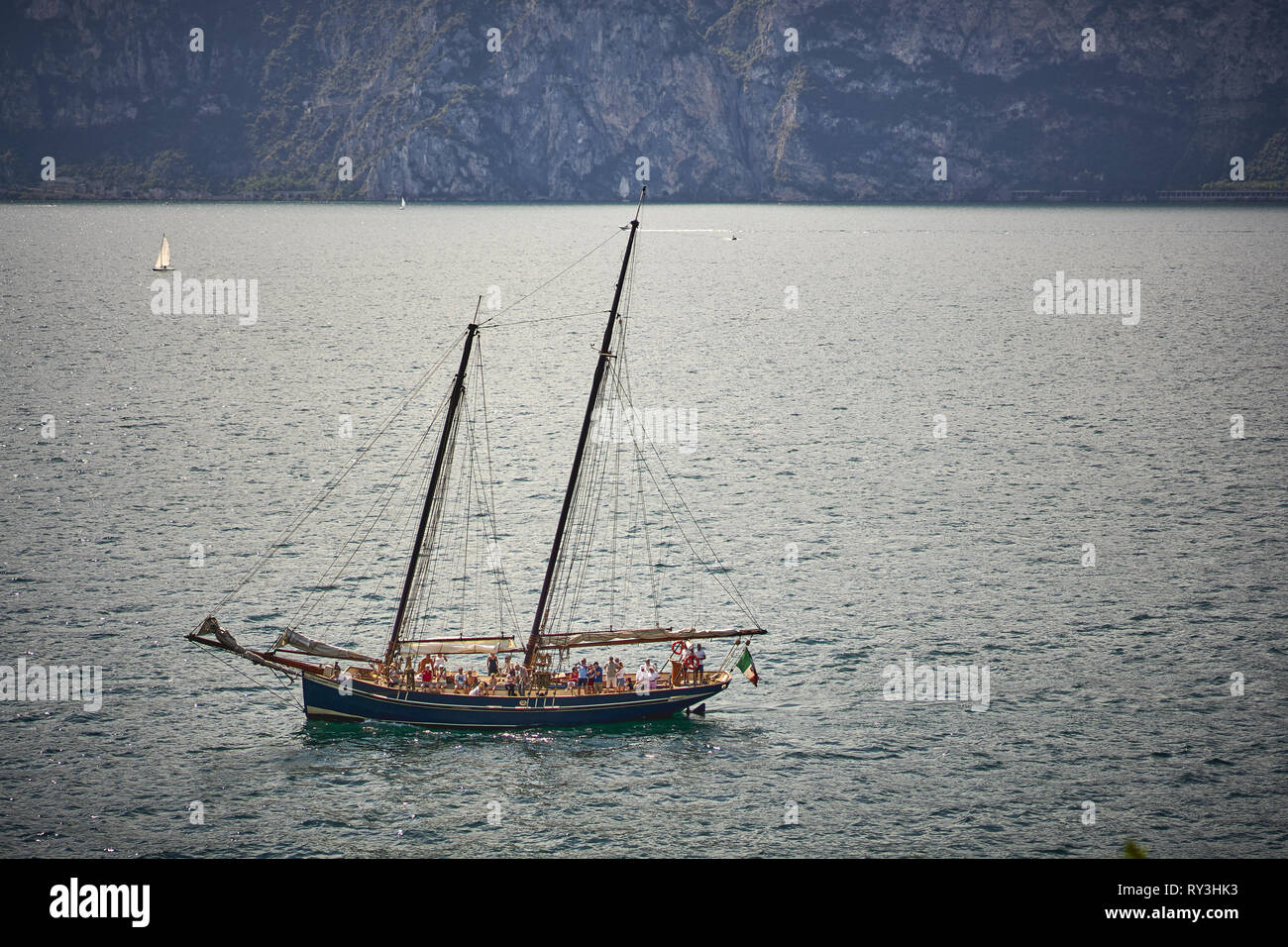 Malcesine, Italy - August, 2018. A sailboat on the lake Garda, the biggest Italian lake, near the town of Malcesine. Stock Photo