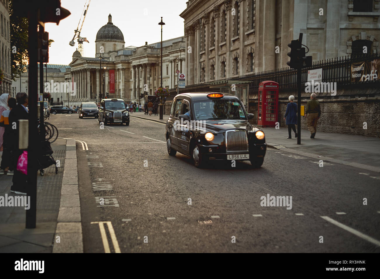 London, UK - September, 2018.  Iconic black cabs near Trafalgar Square in central London. Stock Photo