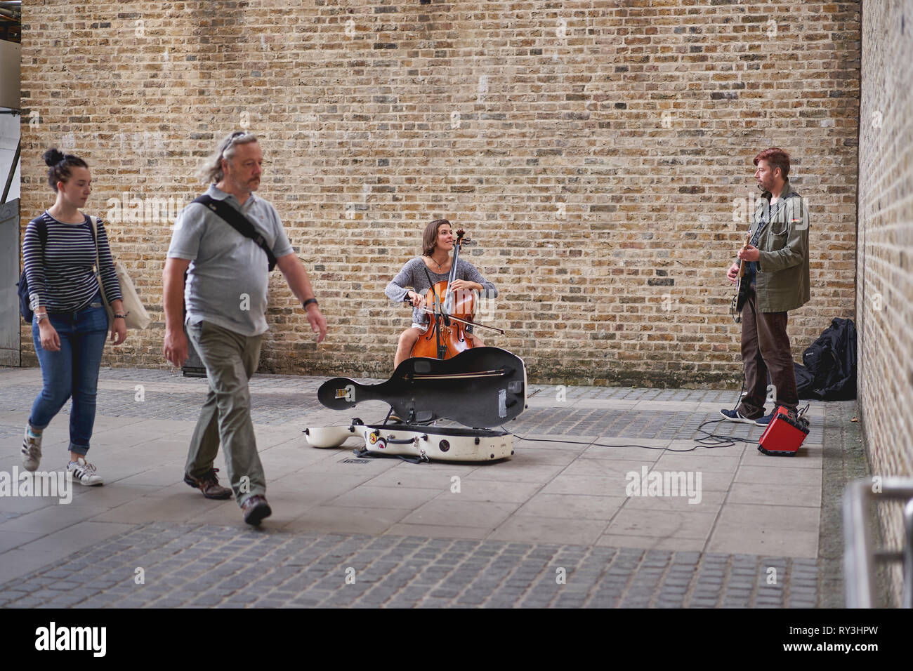 London, UK October, 2018. A street band formed by a guitarist and a