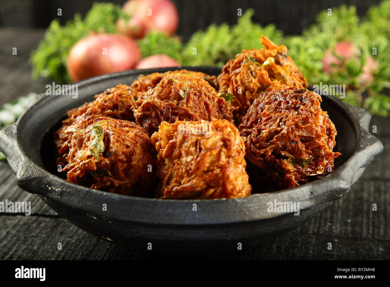 Spicy crispy fried onion fritters , ulli vada, pakora,pakoda, Indian recipes Stock Photo