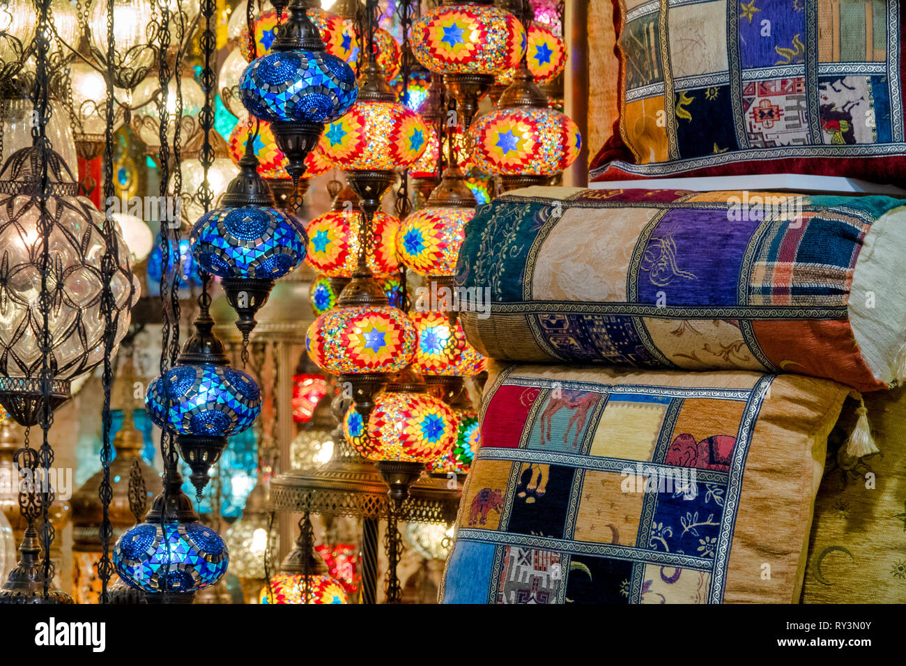 Close up shot of a hanging mosaic lamp and cushions in the Grand Bazaar, Istanbul, Turkey Stock Photo
