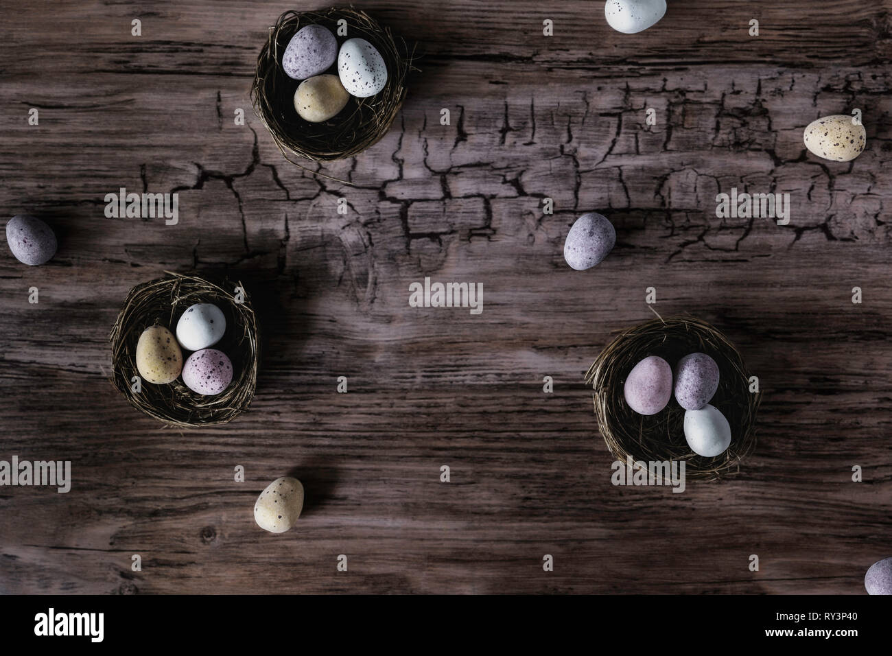 Looking down on chocolate Easter eggs laid out in nests Stock Photo