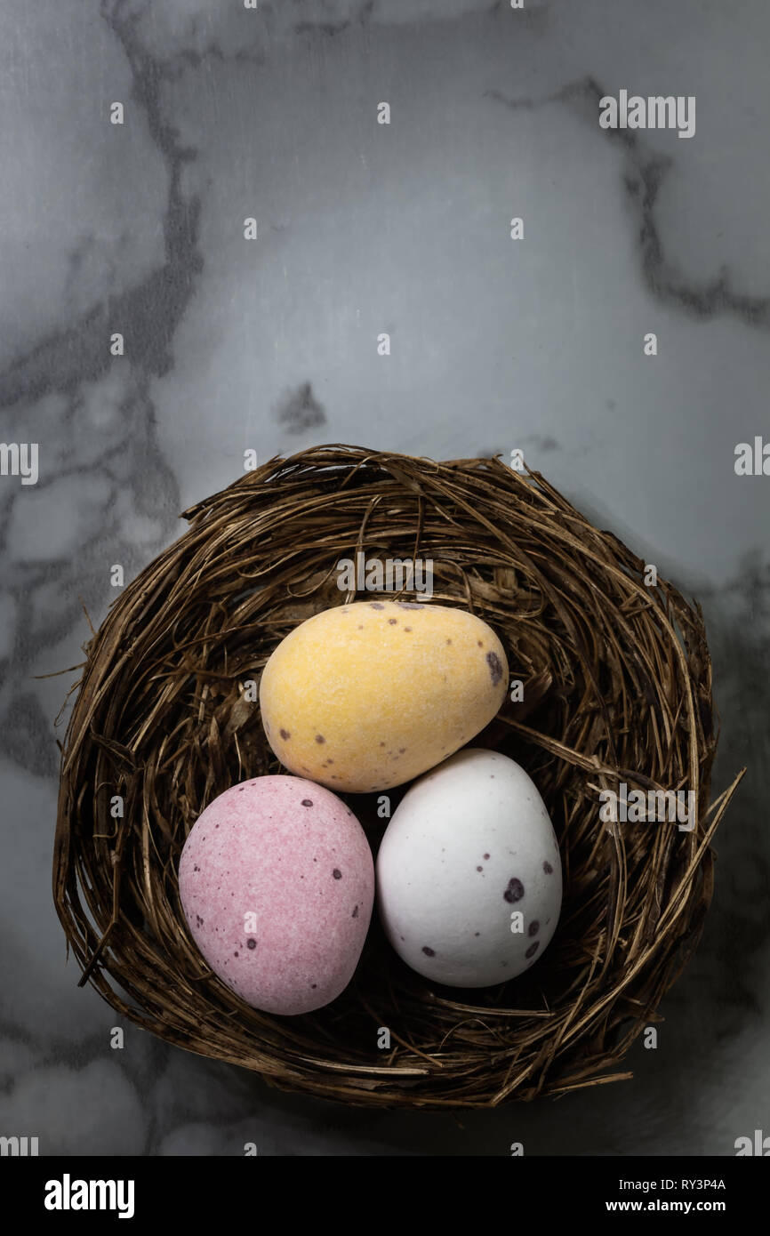 Looking down on chocolate Easter eggs laid out in nests Stock Photo