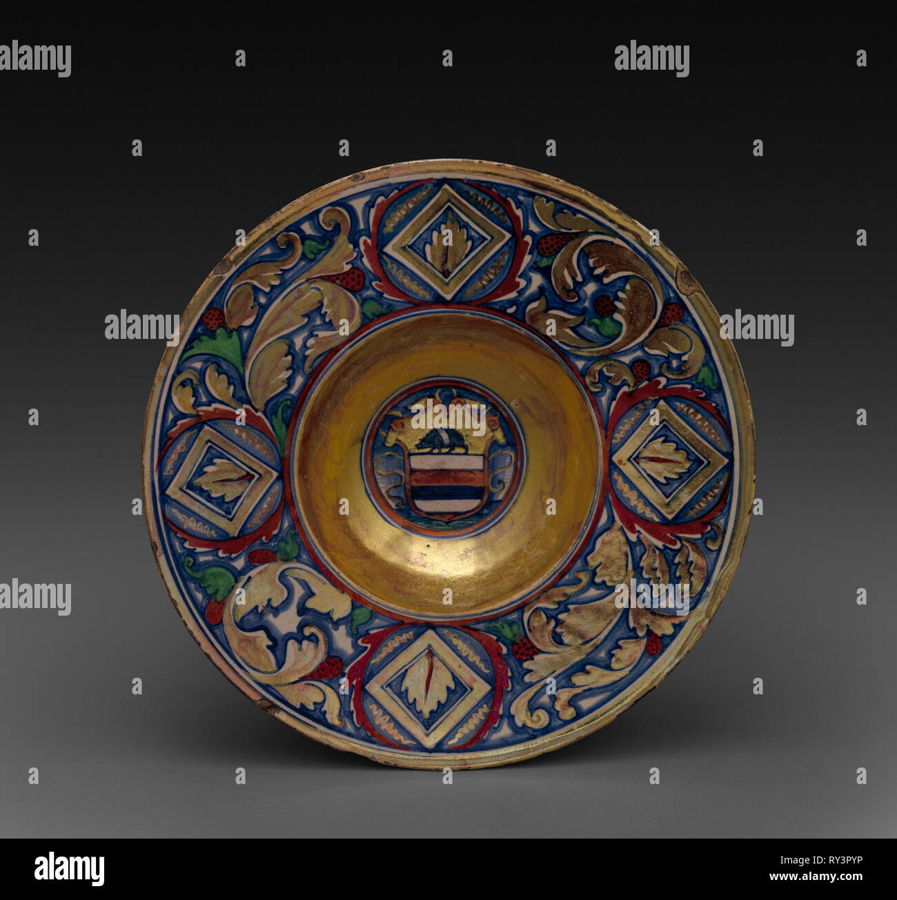Plate: The Arms of the Rizzardi of Vencice, c. 1525-1530. Attributed to Maestro Giorgio Andreoli (Italian, 1465-70-aft 1553). Tin-glazed earthenware with gold and red lustre (maiolica); diameter: 26.7 cm (10 1/2 in Stock Photo