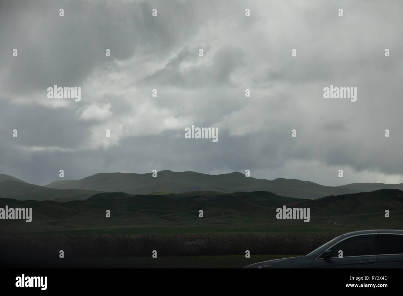 Cloudy sky with top of car Stock Photo