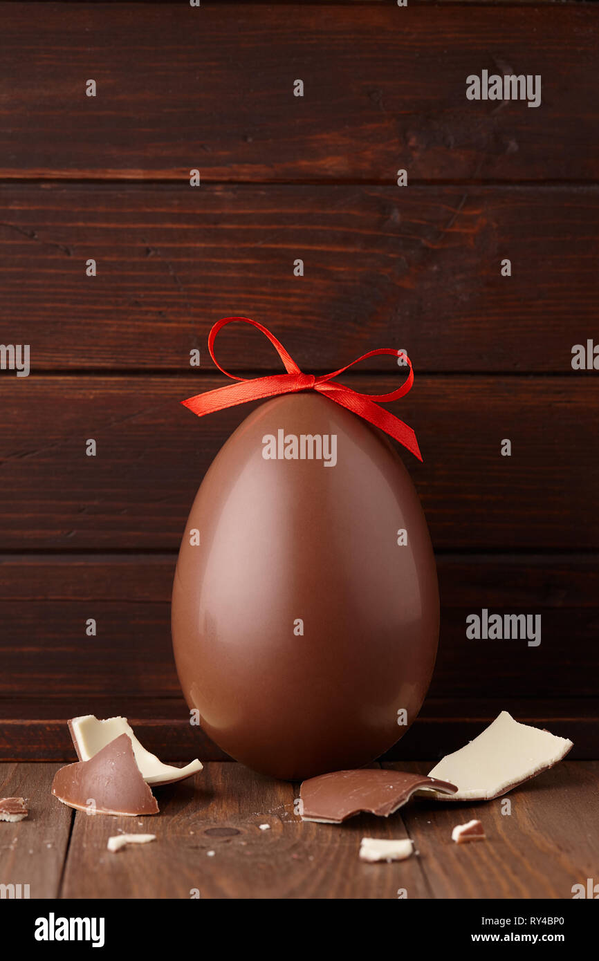 Chocolate Easter egg gift with red bow Stock Photo Alamy