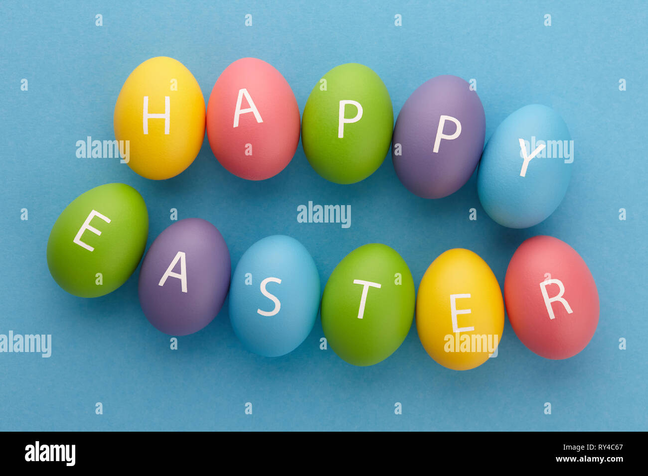 Painted eggs arranged in Happy Easter greeting Stock Photo