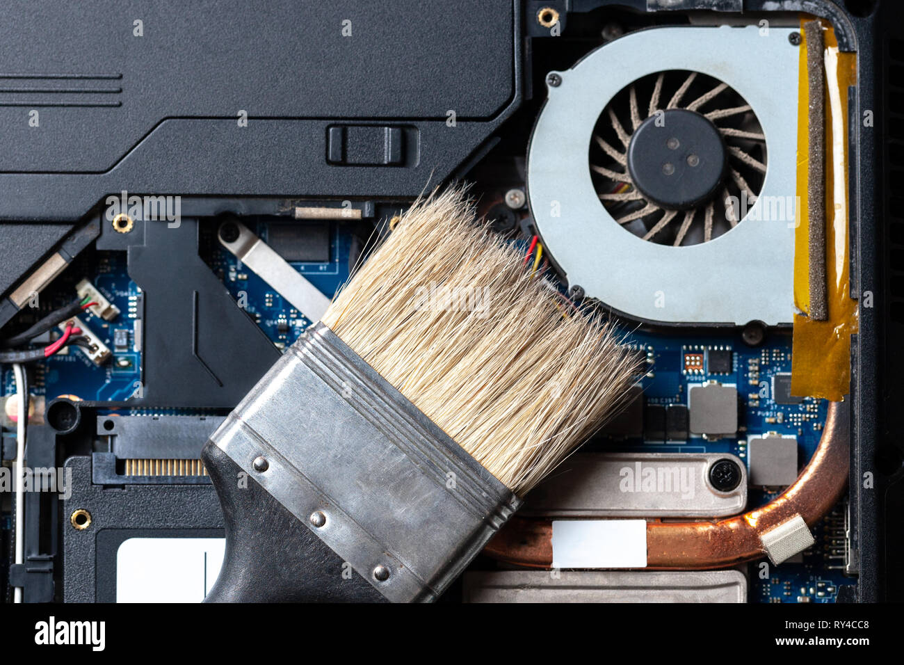 laptop computer motherboard dust cleaning. cpu cooler system with dust and  web. electronics maintenance at service Stock Photo - Alamy