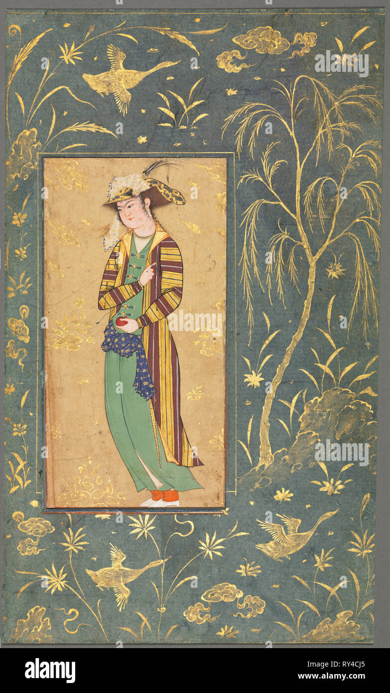 Youth Holding a Pomegranate; Illustration from a Single Page Manuscript, c.1600-1650. Style of Riza-yi Abbasi (Iranian). Opaque watercolor and gold on paper; image: 15.3 x 8 cm (6 x 3 1/8 in.); overall: 27.7 x 16.4 cm (10 7/8 x 6 7/16 in Stock Photo