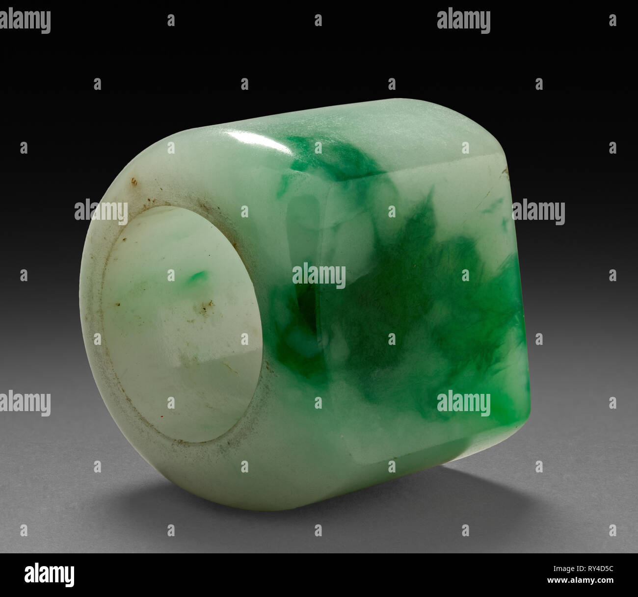 Thumb Ring, 1800s-1900s. China, 19th-20th century. Green and white jade; diameter: 3.6 cm (1 7/16 in.); overall: 3 cm (1 3/16 in Stock Photo