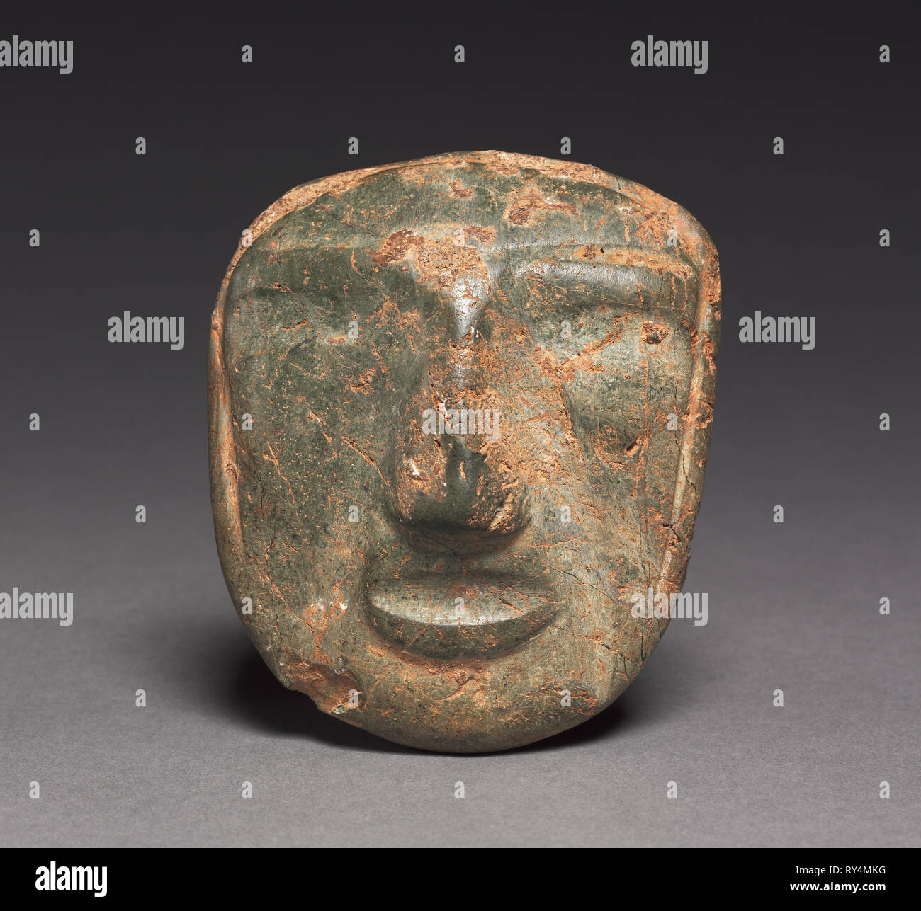 Mask, 1-800. Mexico, Guerrero, Mezcala style. Stone; overall: 10.2 x 9 x 3 cm (4 x 3 9/16 x 1 3/16 in Stock Photo