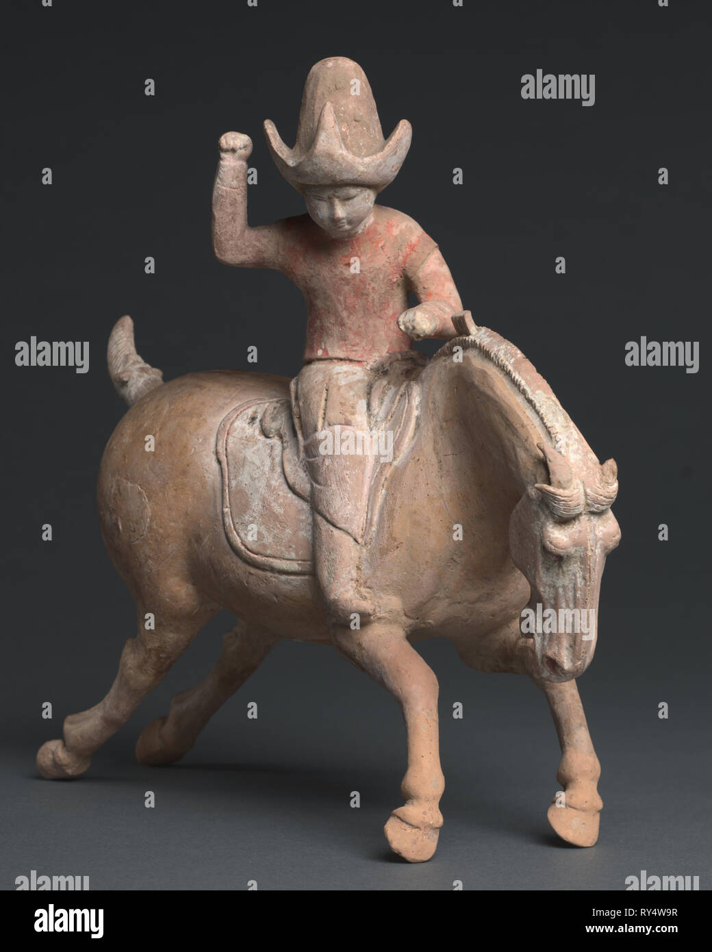 Polo Player, late 7th-early 8th Century. China, Tang dynasty (618-907). Painted earthenware; overall: 31.2 cm (12 5/16 in Stock Photo