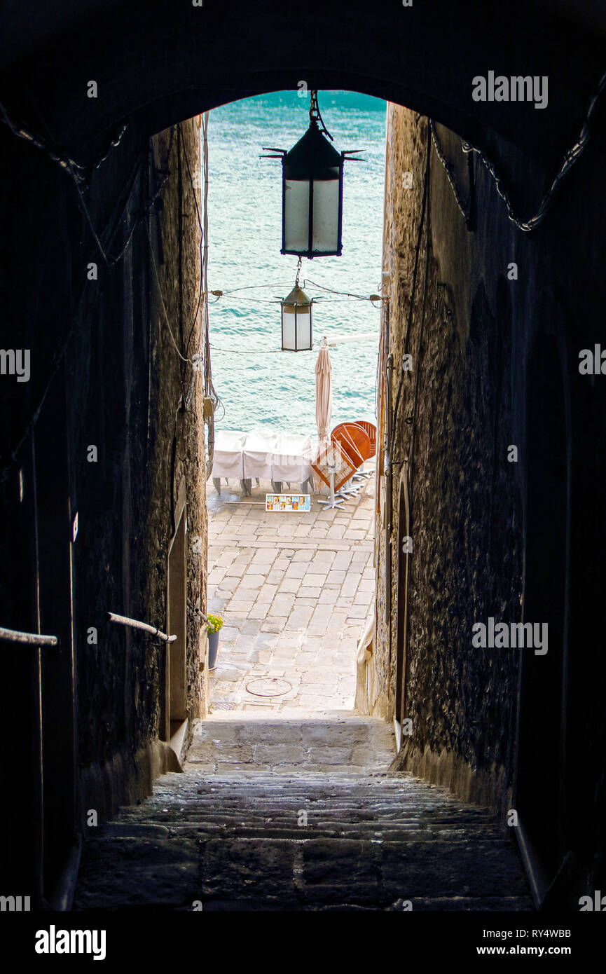 Old center of Porto Venere in Liguria, with its  narrow streets leading to the sea Stock Photo