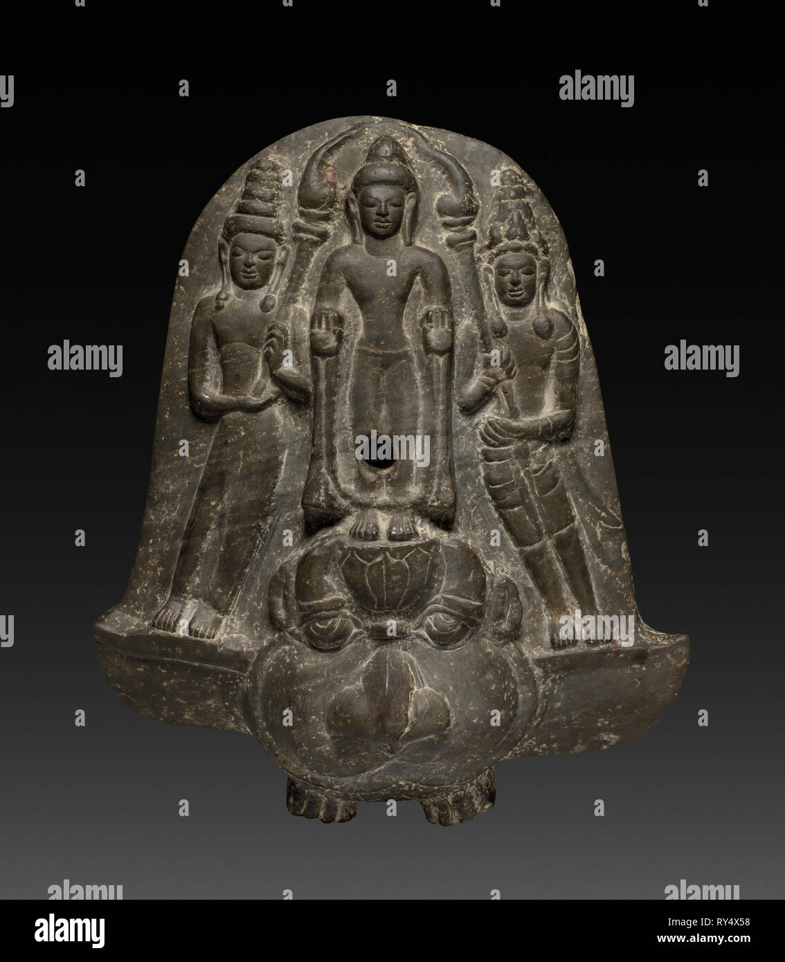 Bracket with Buddha and a Pair of Acolytes, 700s-800s. Thailand, Mon-Dvaravati style, probably from Nagara Pathama, 8th-9th Century. Gray schist; overall: 43.5 cm (17 1/8 in Stock Photo