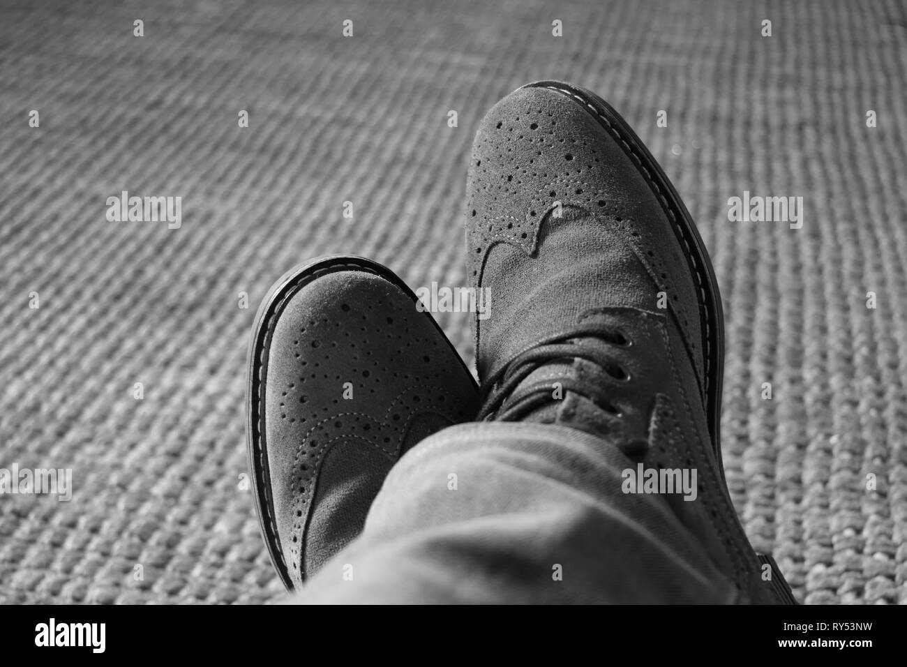 Top view from man with brown leather shoes and jeans Stock Photo