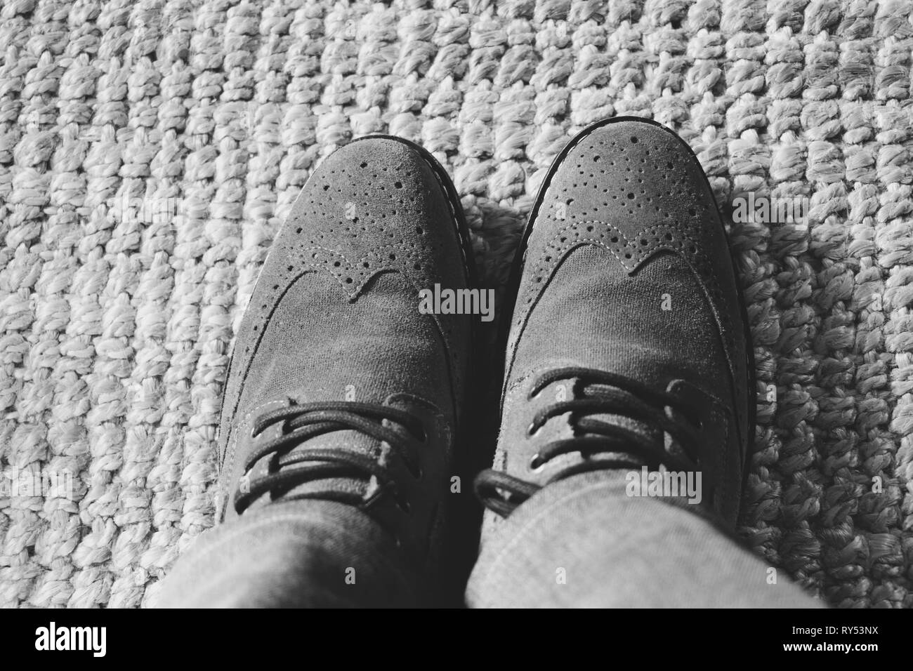 Top view from man with brown leather shoes and jeans Stock Photo