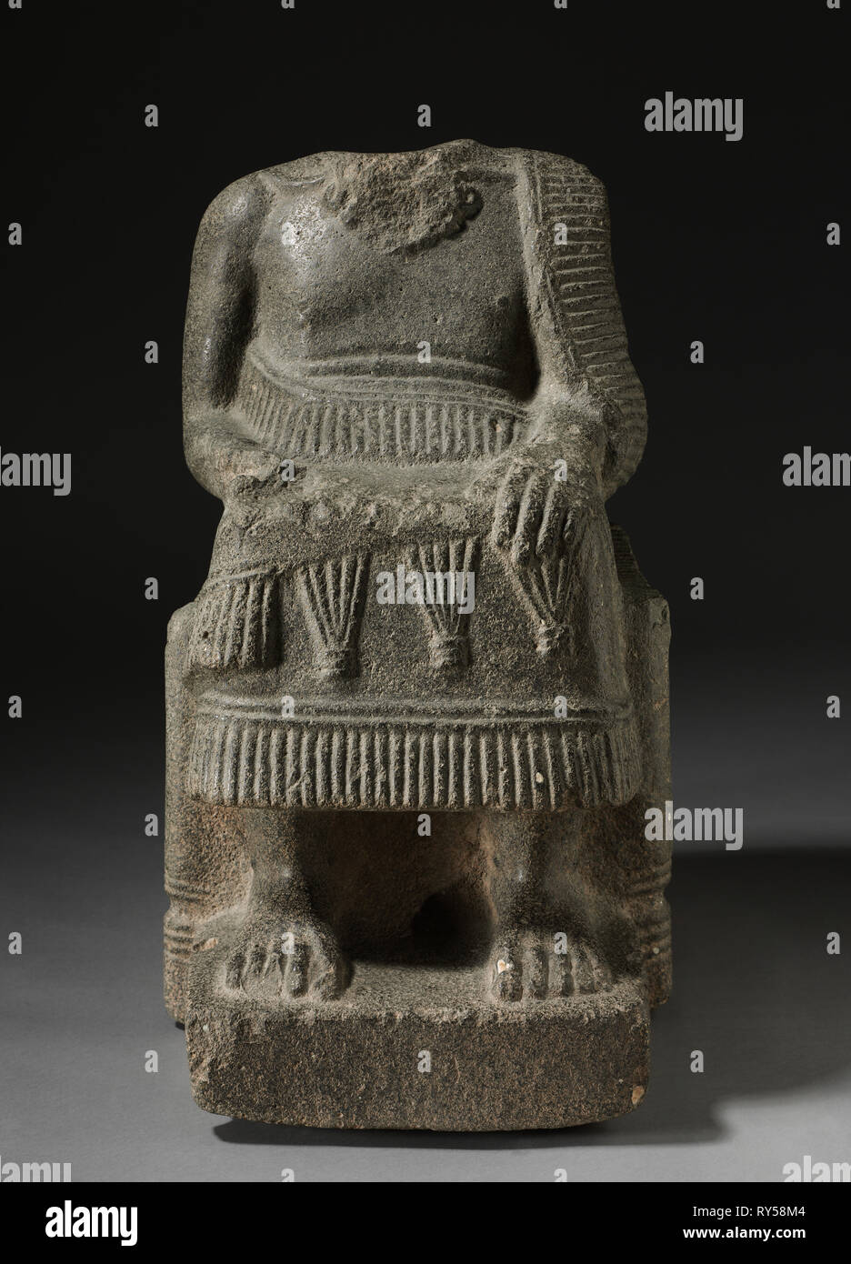 Seated Ruler, 2000-1700 BC. North Syria, possibly the area of Ebla, 2000-1700 BC. Limestone with shell inclusions; overall: 66.7 x 38.2 x 54.6 cm (26 1/4 x 15 1/16 x 21 1/2 in Stock Photo