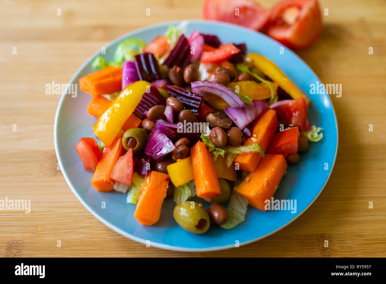 a colourful vibrant vegan salad on a small plate Stock Photo