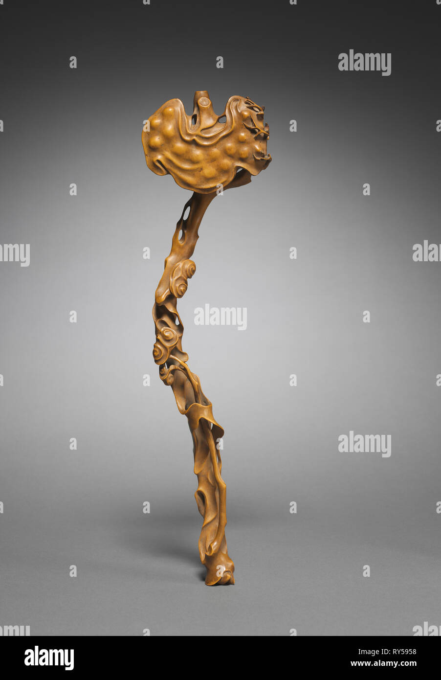 Scepter in the Shape of a Ruyi Fungus, 1700s. China, Qing dynasty (1644-1911). Carved boxwood; overall: 38.1 cm (15 in Stock Photo