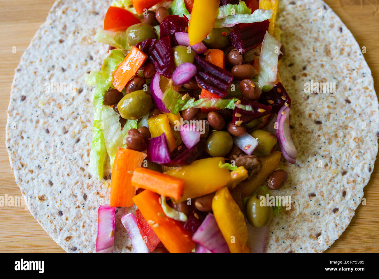 colourful vibrant healthy salad in an open wrap. Vegan, veganism Stock Photo