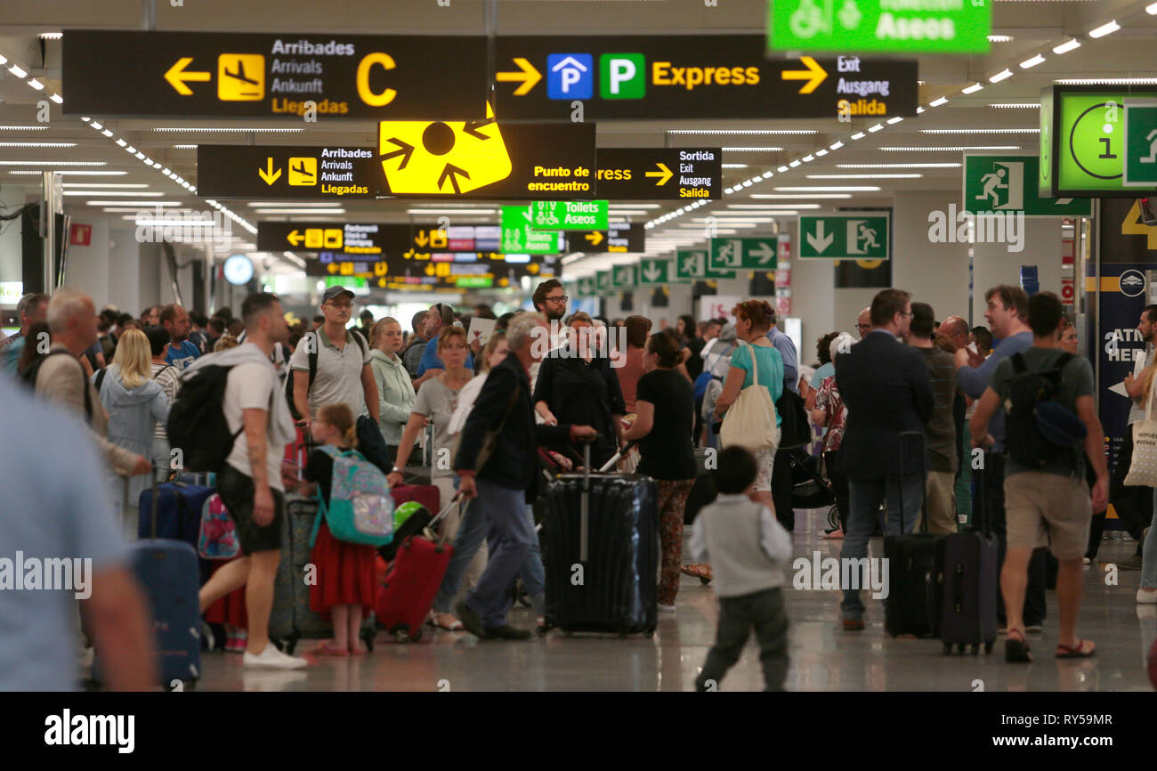 Tourists seen at Palma de Mallorca airport during a high intensity arrival  flights day, in the Spanish islan Stock Photo - Alamy