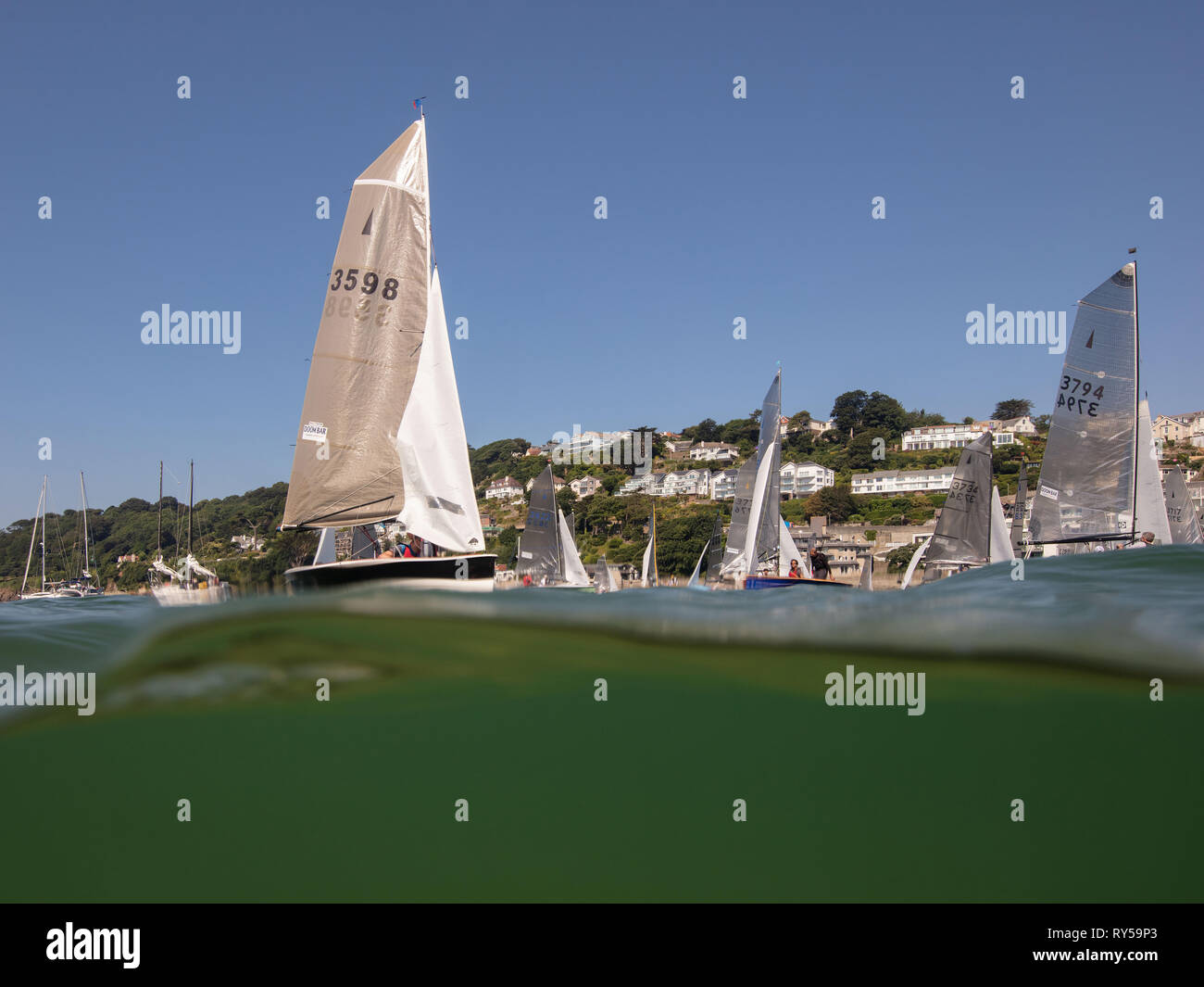 Yachts sailing in Salcombe Town Regatta in the summer. Stock Photo