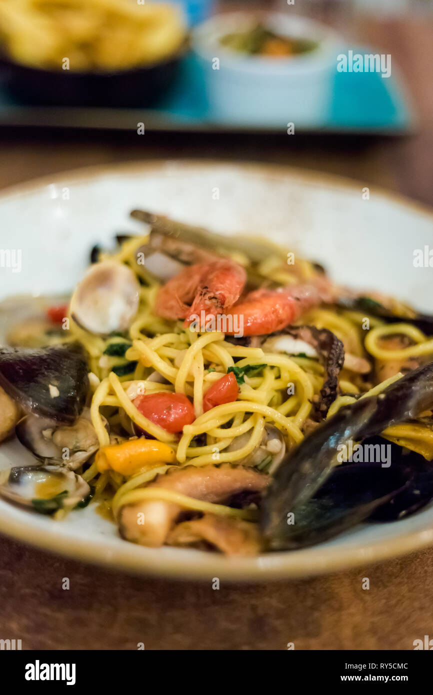 Traditional maltese seafood mix spaghetti with calamari, giant shrimps
