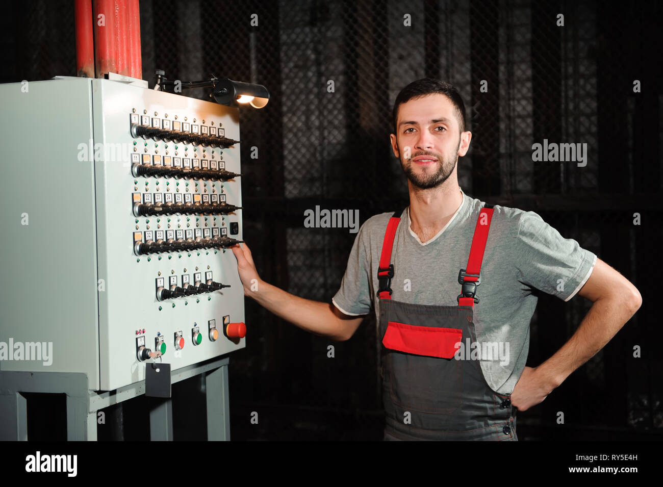 The lighting engineer adjusts the lights on stage behind the scenes