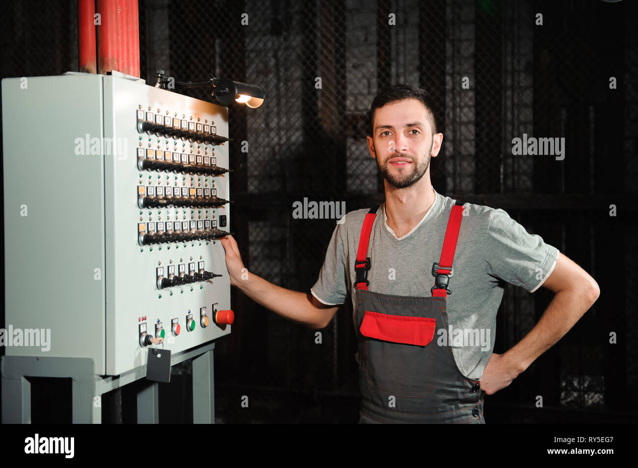 The lighting engineer adjusts the lights on stage behind the scenes