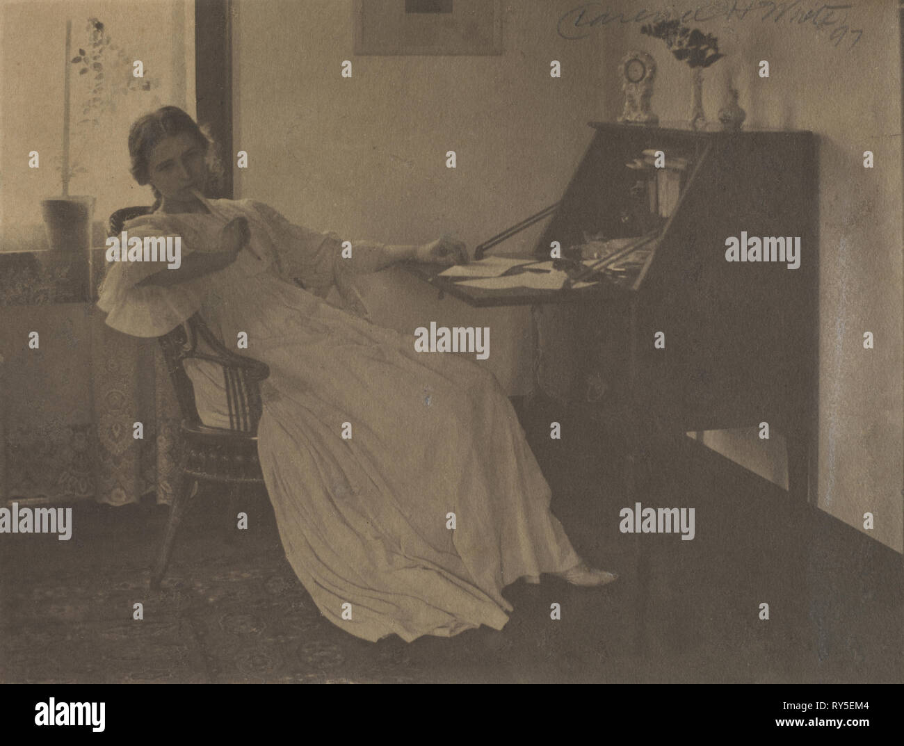 What Shall I Say?, 1896. Clarence H. White (American, 1871-1925). Platinum print with graphite; image: 14.9 x 19 cm (5 7/8 x 7 1/2 in.); matted: 35.6 x 45.7 cm (14 x 18 in Stock Photo